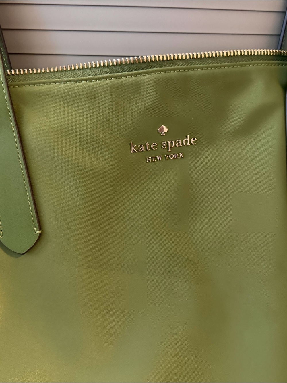 kate spade New York green tote with gold logo
